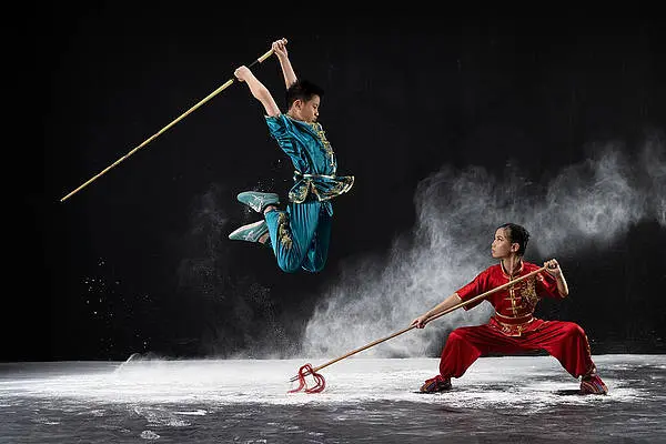 Brother and sister practicing Wushu together